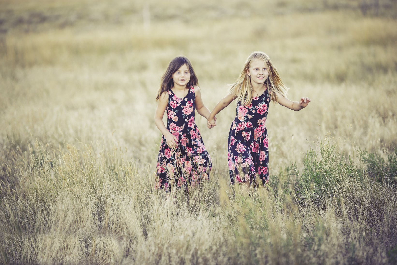 Two Little Girls Running in the Field