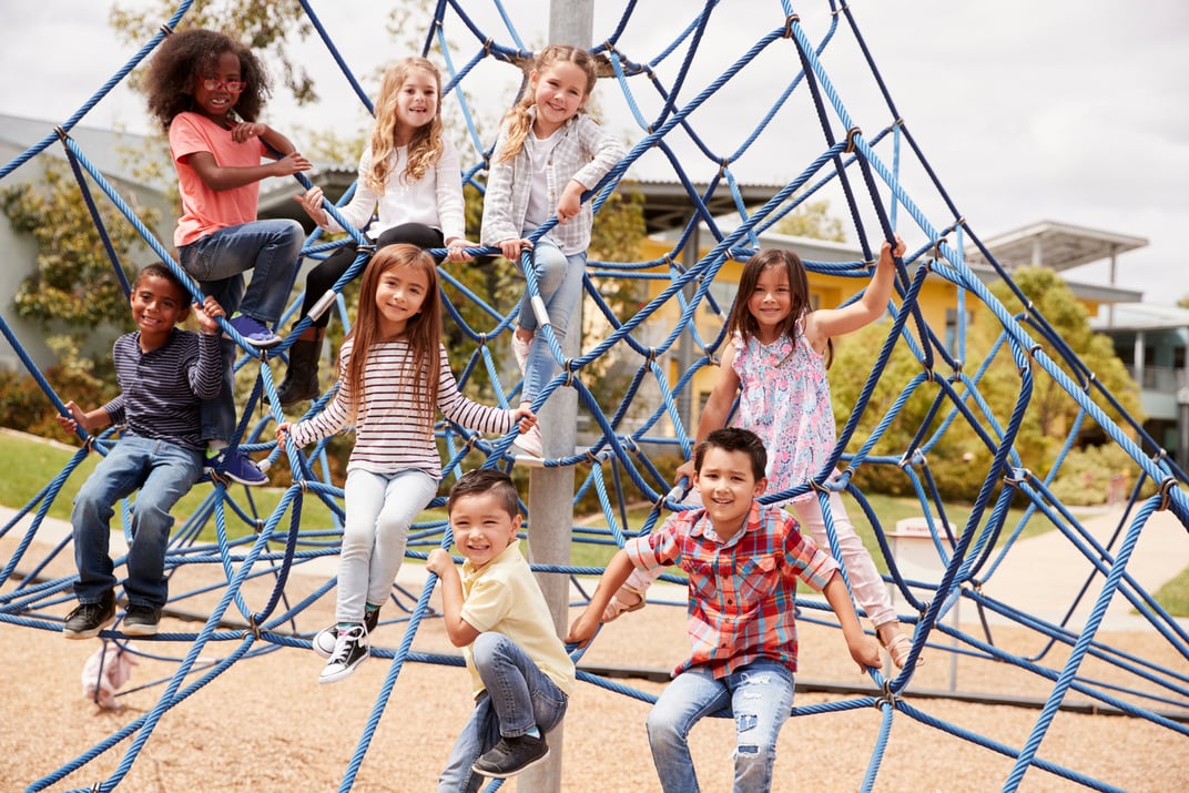 Elementary School Kids Climbing in the School Playground